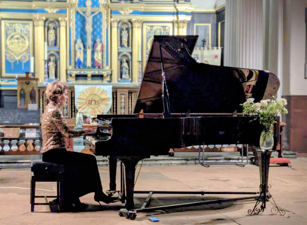 ya performing on St Chad's grand piano