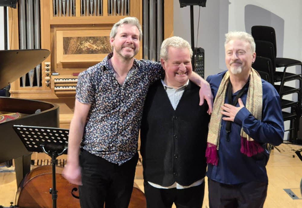 Gwilym Simcock, Malcolm Creese and Tim Garland, a.k.a. Acoustic Triangle, enjoying well-deserved applause at the end of their concert.